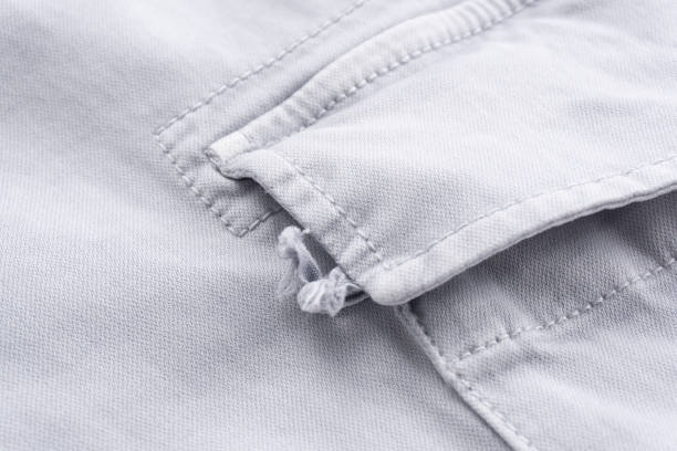 istock Grey - blue cargo pants pocket detail closeup 1371150631