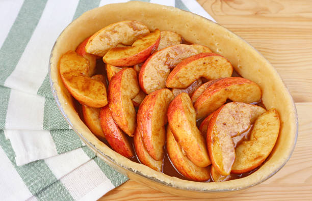 istock Closeup of pie plate with fresh mixed filling before baking a apple pie 1371151200