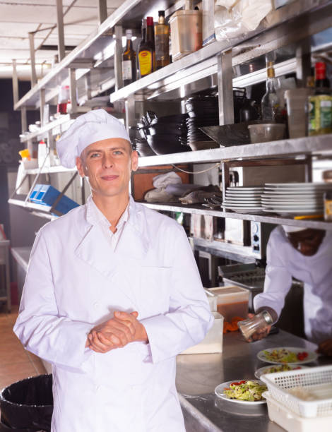 istock Confident chef of restaurant posing in kitchen 1371151708