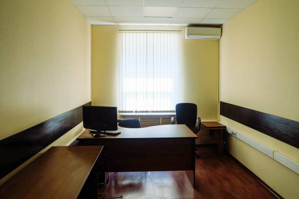 istock Empty office room with bright window and air conditioner 1371153003