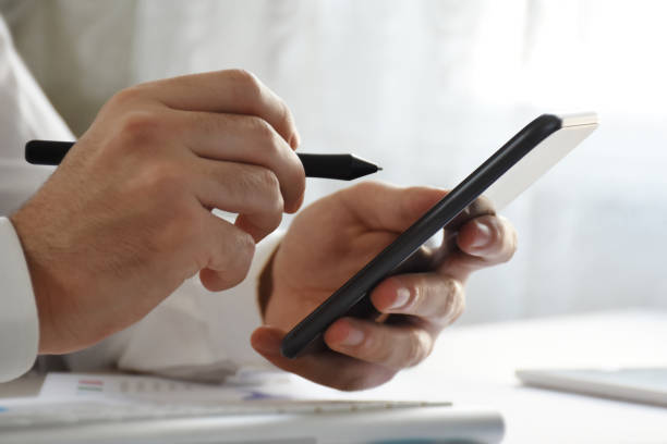 istock Business person using smart phone with digitized pen 1371153064