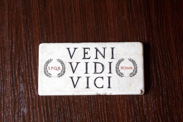 Ancient tablet with roman inscription on the table
