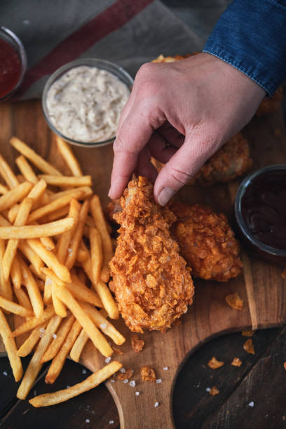 istock Crispy Fried Chicken Drumsticks with French Fries 1371157880