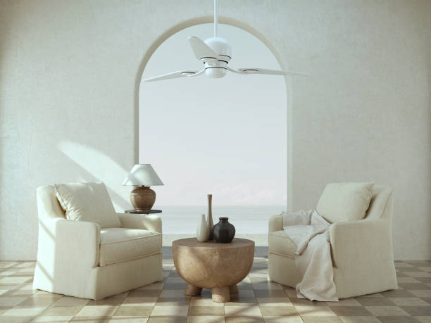 istock Mediterranean style interior.Armchairs,ceiling fan and arch with sea view.3d rendering 1371159352