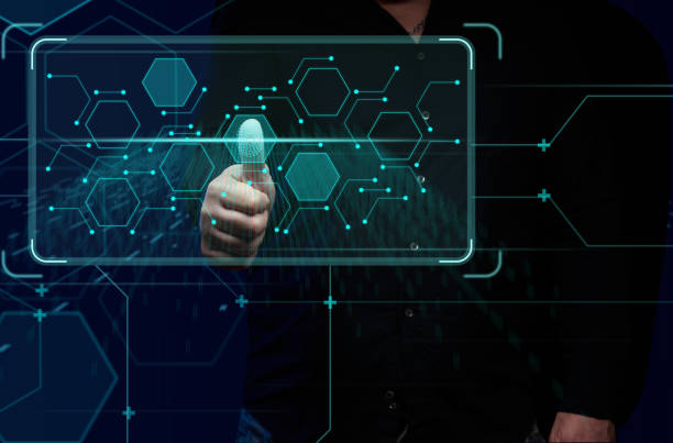istock a man stands in front of a virtual screen with a security system and fingerprint identification. Personal data protection, online security 1371159492
