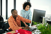 istock Young business partners working on project in modern office 1371160707