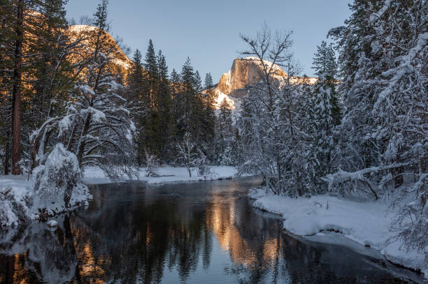 istock Sunset at Half dome reflected in the merced rivier 1371162632