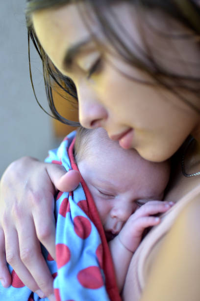 istock newborn baby in arms 1371164073