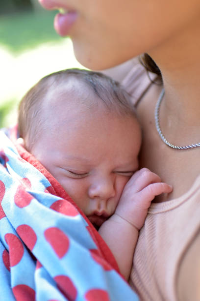 istock newborn baby in arms 1371164089