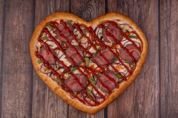istock heart shaped pizza on wooden background for restaurant menu11 1371166030