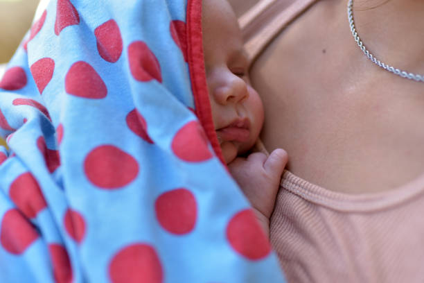 istock newborn baby in arms 1371167409