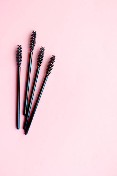 istock Eyelash brushes concept, mascara on pink background. mockup with copy space 1371167476