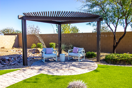 Pergola With Two Arm Chairs On Pavers Patio