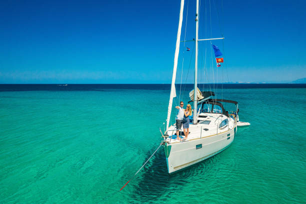istock Couple on anchored sailboat, view from drone 1371168400