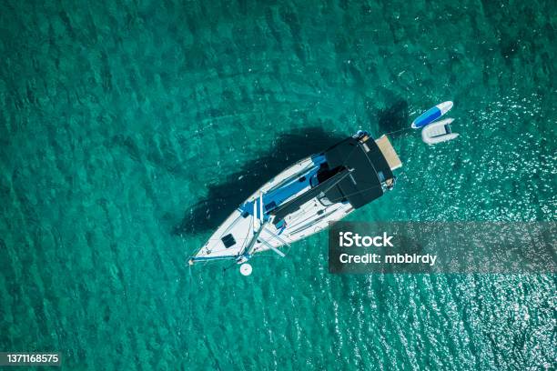 Anchored Sailboat View From Drone Stock Photo - Download Image Now - Sailboat, Lifeboat, Sailing Dinghy