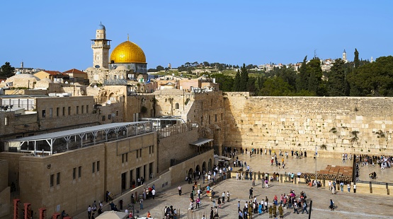 East Jerusalem, Palestine, May 1, 2019: View of the Western Wall and the Temple Mount with the Dome of the Rock in the Old City of Jerusalem on a sunny spring day.
