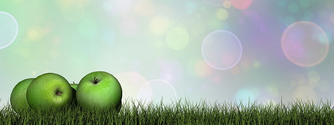 Green apples on the grass - 3D render