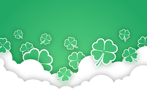 Cloudscape with green shamrock design background.