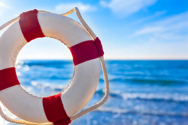 View through and beside nostalgic life buoy decoration to sea horizon (copy space)