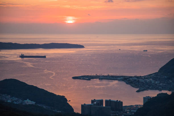 istock Cargo ship during sunset in the bay 1371180758
