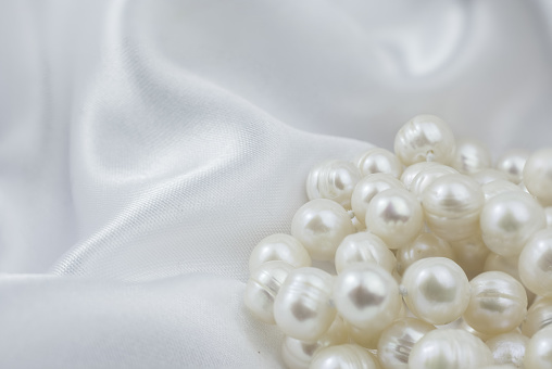 Elegant white background  and natural  pearl
