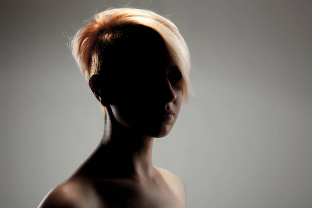 Portrait of serious woman at hair salon after hair treatment