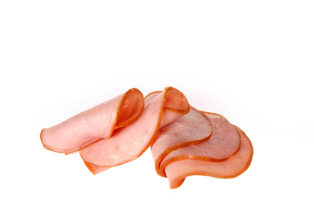 istock Pork ham slices isolated on white background 1371184777