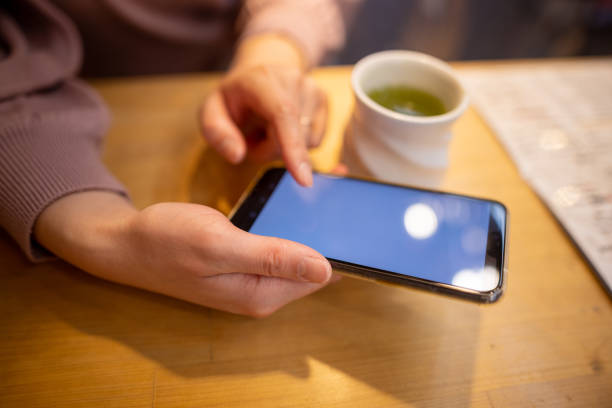 Woman buying ticket, making reservation, ordering something through smart phone app