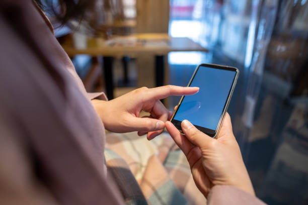 istock Woman buying ticket, making reservation, ordering something through smart phone app 1371185964