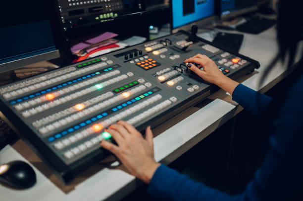 istock Woman hands using equipment in control room on a tv station 1371188744