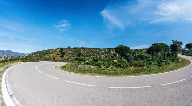 istock Empty long road on a sunny summer day at bright sunset 1371189823