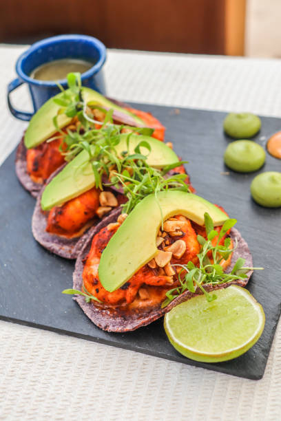 mexican shrimp tacos with avocado and guacamole dip