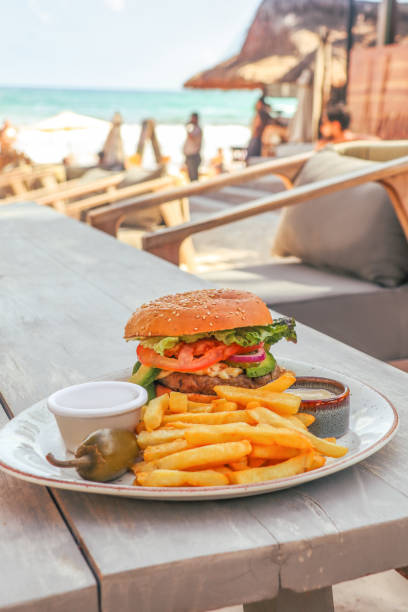 istock Angus Beef cheese Burger with avocado and fried in tulum beach bar restaurant 1371193767