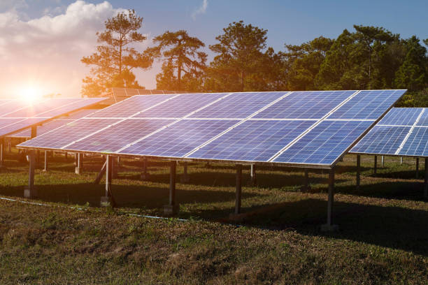 istock Solar module panels against sunset sky background. Environmental energy resources concept. 1371195315