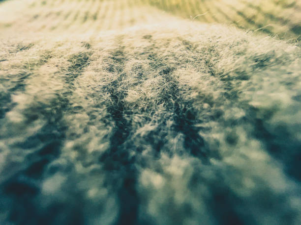 A macro shot of the fine white fabric.