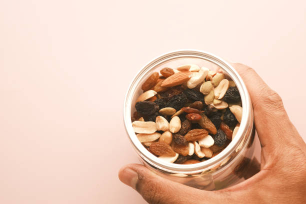 istock close up of many mixed nuts in a container 1371204415