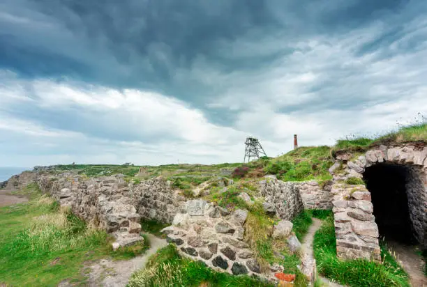 Photo of Botallack Crown tin mines,historic ruins,under looming stormy clouds,in mid summertime,Cornwall,England,UK.