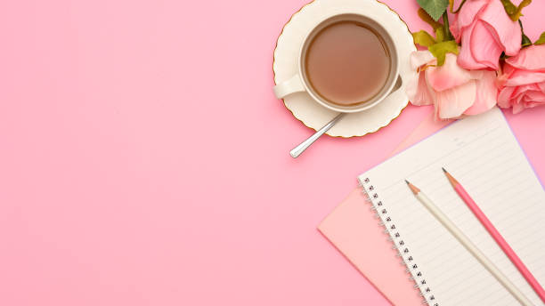 istock Feminine office desk workspace in pink background 1371208750