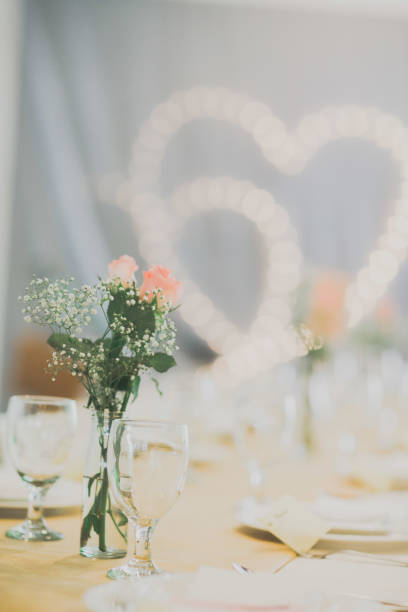 istock Roses and baby's-breath placed on the table with blur background 1371210424