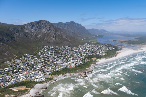 Aerial shot looking down towards the town of Hermanus near Cape Town. Small coastal town