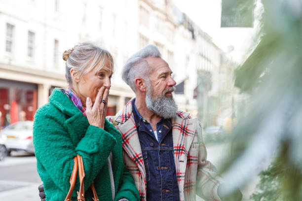 Stylish senior couple window shopping