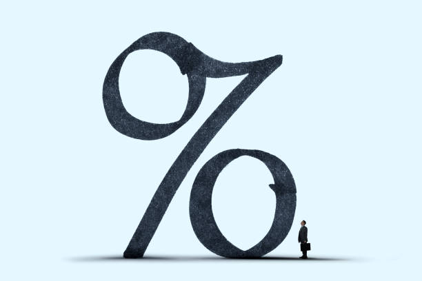 istock Man Standing In Shadow of High Interest Rates 1371218465