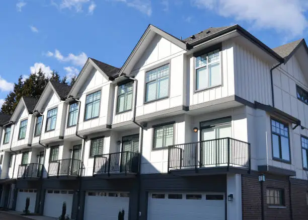 Looking at new townhomes from the street in the sunshine in suburban Vancouver, B.C.