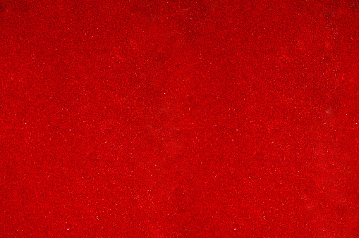 Grunge effect glowing creased red  backgrounds - suitable to use as wallpaper, greeting cards or posters templates for Christmas, love theme Valentine Day backdrops. There is No people and No text. There is copy space for text.
