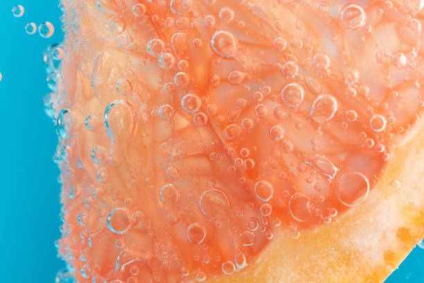 istock Grapefruit in the water under the water close-up macro. Background, fresh fruit. Selective focus. 1371234055