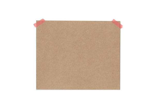 istock blank brown note paper background and red tape 1371234101