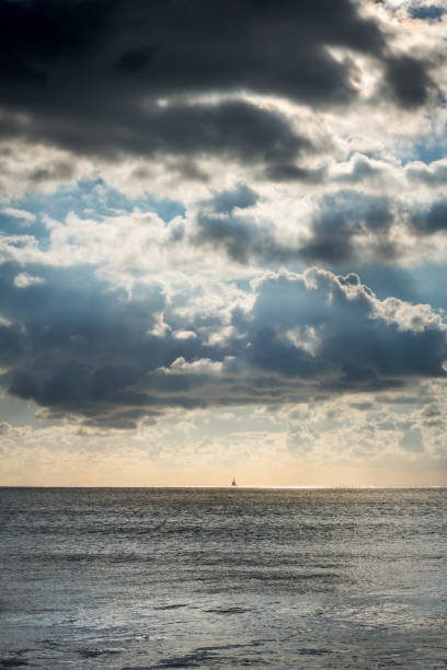 istock Cloudy seascape view from a beach at sunset 1371234833