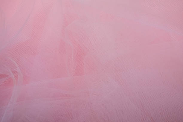istock delicate airy white fabric with folds on a pink background 1371237336