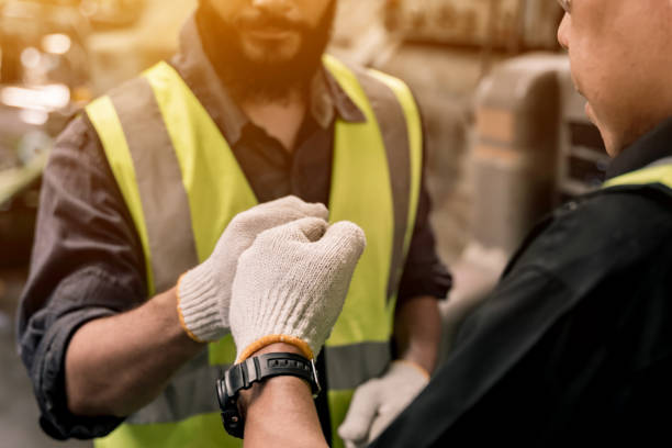 istock Industrial factory concept. Engineering handshake with technician and worker operating and maintenance of machinery. 1371238716