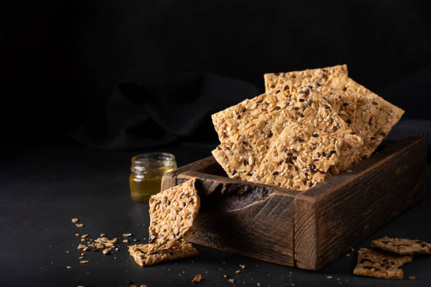 istock thin whole grain crispbreads with seeds and sesame seeds, close-up 1371243320